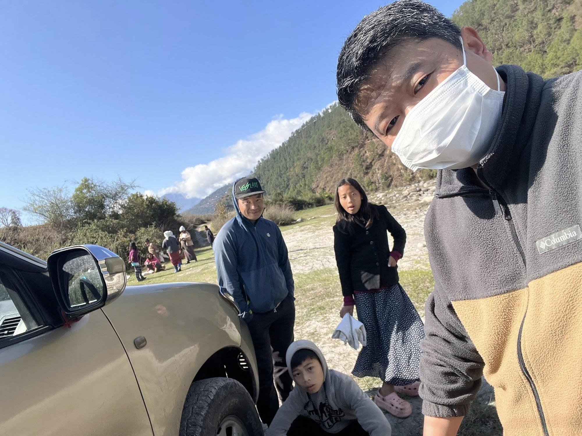 May be an image of one or more people, people camping, car, jeep, mountain and road